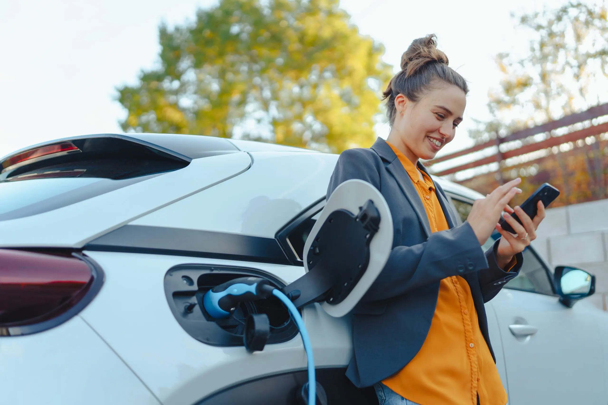 person charging electric car