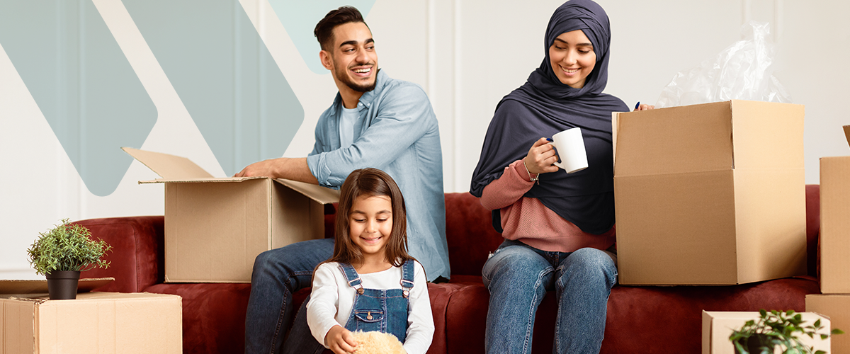 Family with moving boxes in home